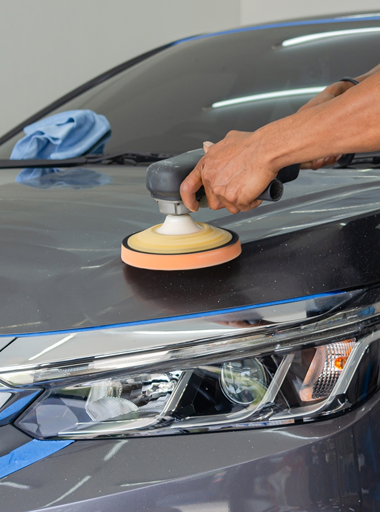 Man polishing car body